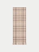 A long rectangular scarf with a beige and brown plaid pattern and fringed ends, shown flat against a light gray background.