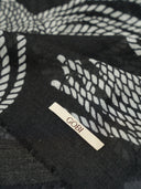 Black fabric with white geometric pattern and 'Gobi' label #color_coconut-milk