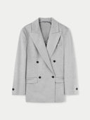 A double-breasted gray cashmere blazer with peak lapels, buttoned cuffs, and front button closure. #color_vapor-blue
