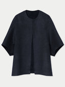 A black cashmere poncho jacket with a short, crew-neck design. #color_charcoal