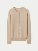 Beige crew neck cardigan on a light beige background #color_beige
