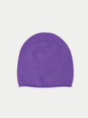 flat lay of a purple beanie hat on a light gray background