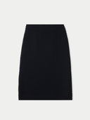 Black ribbed knit pencil skirt on a light gray background #color_black