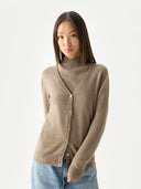 Woman wearing a brown cardigan over a turtleneck sweater on a white background #color_taupe