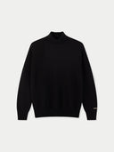 Black turtleneck sweater on a light gray background #color_black