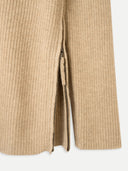 close up of a beige sweater side zip #color_warm-grey