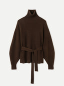 A brown Belted Cashmere Turtleneck sweater with lantern sleeves and a tied belt at the waist.