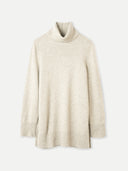 A beige cashmere turtleneck sweater presented against a white background, displaying the relaxed fit and turtleneck design. #color_dawn-blue