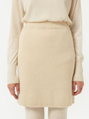 front view of a beige mini skirt with ribbed texture #color_off-white
