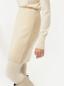 front view of a beige mini skirt with ribbed texture #color_off-white