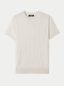 A beige silk cashmere t-shirt with short sleeves and a round neckline. #color_whisper-white