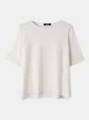 A box-cut cotton silk cashmere blend t-shirt in white color with short sleeves and a round neckline. #color_whisper-white