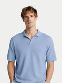 Man wearing a light blue polo shirt against a plain background #color_celestial-blue