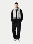 Man wearing a black outfit with a white scarf on a white background #color_dawn-blue