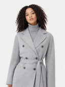close up front view of Woman wearing a gray coat with a white background #color_vapor-blue