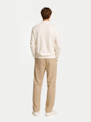 back view of a white sweater and beige pants on a light gray background #color_marshmallow