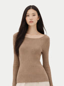 Woman wearing a brown sweater on a white background #color_timber-wolf