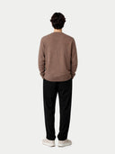 back view of a man wearing a brown cardigan and black pants on a white background #color_taupe