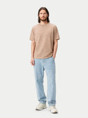 Man wearing a beige t-shirt and light blue jeans on a white background #color_timber-wolf