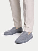 Gray slippers worn with beige pants on a white background #color_steel-gray