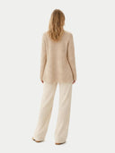back view of a beige cardigan and pants on a white background #color_warm-grey