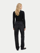 back view of a woman wearing black cardigan and a black jeans on a white background #color_all