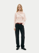 Woman wearing a light pink sweater with a scarf and black pants on a white background #color_all