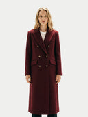 Woman wearing a burgundy coat on a white background #color_bordeaux