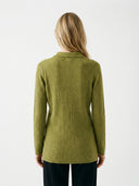 Person wearing a green ribbed sweater on a white background #color_dark-citron