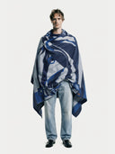 Man wearing a blue and white patterned blanket on a white background #color_india-ink