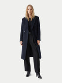 Woman wearing a long dark coat on a white background. #color_black