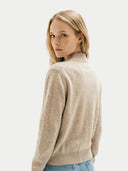 close up back view of a Woman wearing a beige sweater on a white background #color_beige