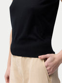 close up of a black top and beige botoms #color_black
