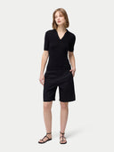 front view of a black polo shirt and pants  #color_black