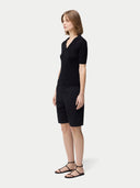 side view of a black polo shirt and pants  #color_black