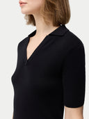 close up of a black polo shirt  #color_black