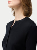 close up of a black crew neck cardigan #color_black
