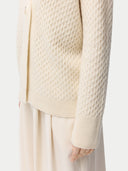 close up of a beige cardigan #color_off-white