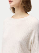 close up of a white sweater #color_whisper-white