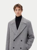 close up of Man wearing a gray overcoat on a white background #color_dim-gray