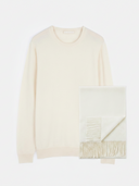 Cream-colored sweater with a textured pattern on a white background #color_white-off