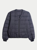 Flat lay of the collarless quilted inner jacket of the CashmereTech bomber in black, with a full-length zip and ribbed cuffs.