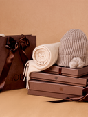 GOBI Cashmere gift boxes and shopping bag with knitted accessories in warm neutral tones