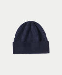 Navy blue knit beanie on a light gray background