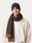 Man wearing a brown beanie and scarf on a white background #color_charcoal
