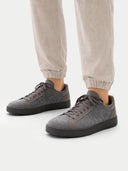 Gray sneakers worn with beige pants on a white background #color_frost-gray