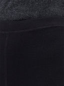 Close-up of a textured fabric with a dark color scheme #color_black