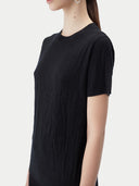 close up of a black wrinkled t-shirt #color_black