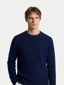 Man wearing a navy blue sweater against a white background #color_navy