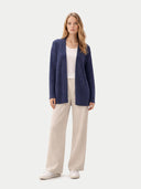 front view of a woman wearing a navy open cardigan, white top, and beige pants on a white background #color_crown-blue